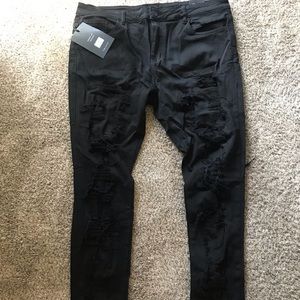 Embellished jeans size 40 jet black size 40 with rips never worn and stylish